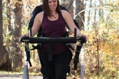 Woman using the Gait Harness System outdoors