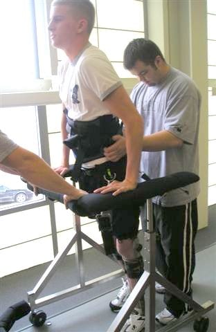 Man using the Gait Harness System with therapist